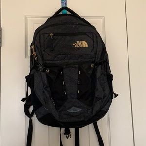 The North Face black backpack.